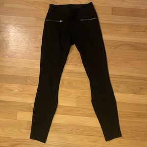 Like new! Athleta legging pant, black with gun metal zippers.